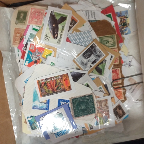32 - Glory box full of world stamps unsorted in chocolate boxes and tins. 1000's of stamps, well worth a ... 