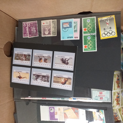 32 - Glory box full of world stamps unsorted in chocolate boxes and tins. 1000's of stamps, well worth a ... 