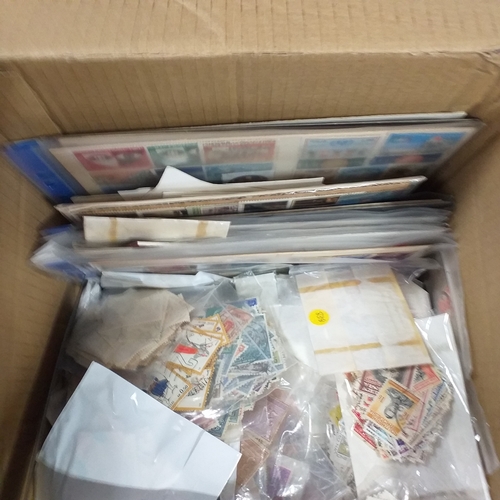 38 - Box containing stamps in packets (all off paper and sorted in to countries) on stock cards, album le... 