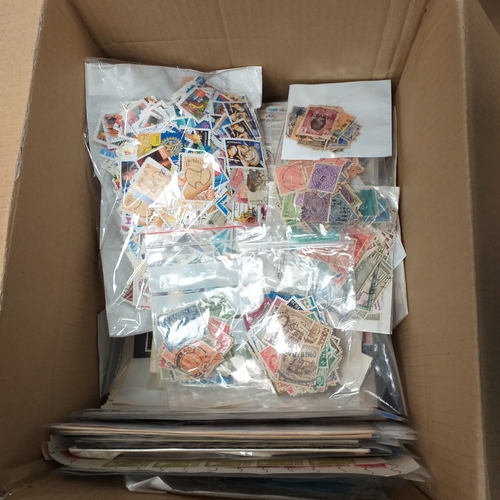 39 - Box containing stamps in packets (all off paper and sorted in to countries) on stock cards, album le... 