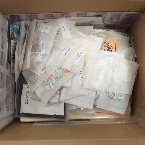 40 - Box containing stamps in packets (all off paper and sorted in to countries) on stock cards, album le... 