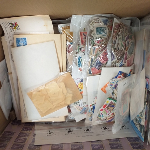 40 - Box containing stamps in packets (all off paper and sorted in to countries) on stock cards, album le... 