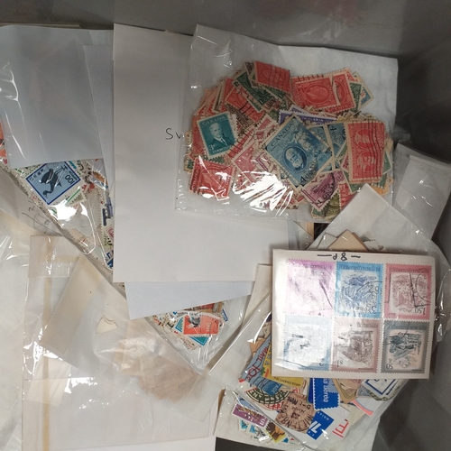 41 - Box containing stamps in packets (all off paper and sorted in to countries) on stock cards, album le... 