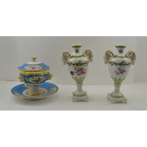 101 - A PAIR OF CONTINENTAL CERAMIC BALUSTER VASES mounted with rams heads to the high shoulders, floral p... 