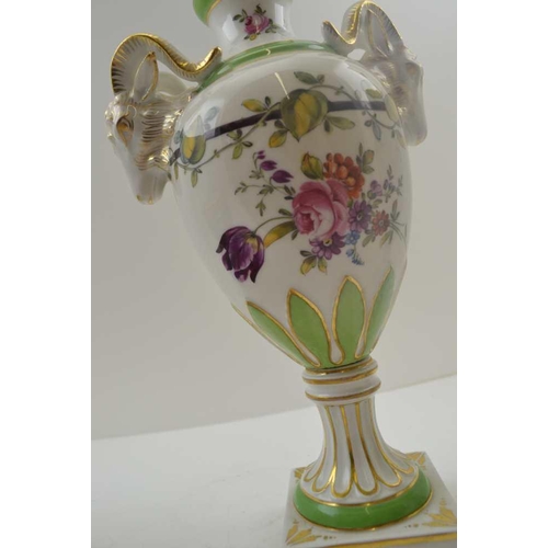 101 - A PAIR OF CONTINENTAL CERAMIC BALUSTER VASES mounted with rams heads to the high shoulders, floral p... 