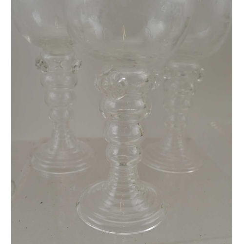 119 - TWO SETS OF ETCHED BOWL ROEMERS, a set of six with clear glass stems and a set of ten with green gla... 