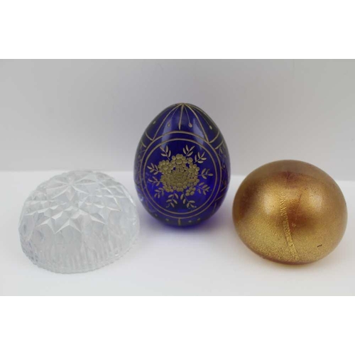 135 - A COBALT BLUE OVOID SHAPE GLASS PAPERWEIGHT, cut and gilded decoration, 9cm high, together with a la... 