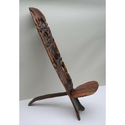 143 - AN EARLY 20TH CENTURY CENTRAL AFRICAN CARVED WOOD BIRTHING STOOL, carved animal decoration, includin... 