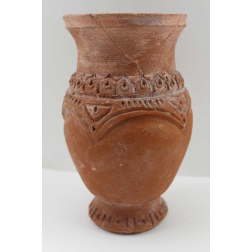 144 - A BYZANTINE TERRACOTTA VASE of baluster form, impressed decorative collar and circular footed base, ... 