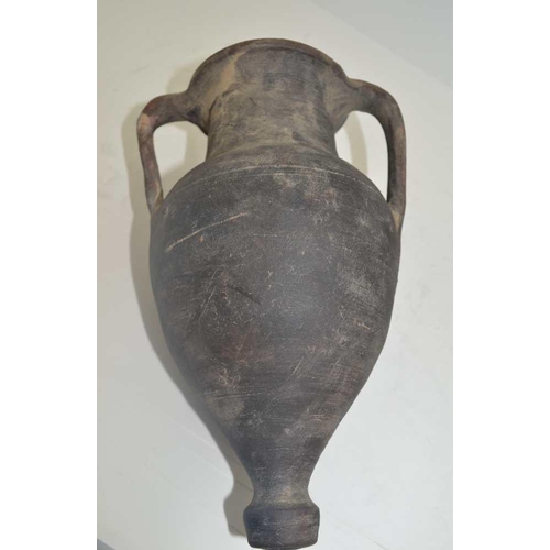 146 - A THRACIAN BLACKWARE CLAY AMPHORA, of classical form with two handles and moulded decoration of a wa... 