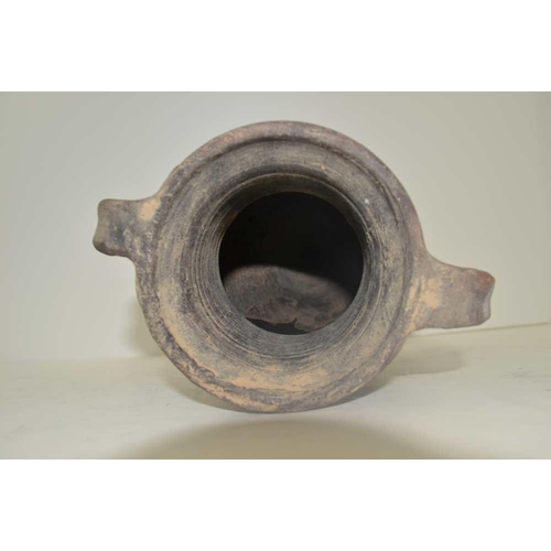 146 - A THRACIAN BLACKWARE CLAY AMPHORA, of classical form with two handles and moulded decoration of a wa... 