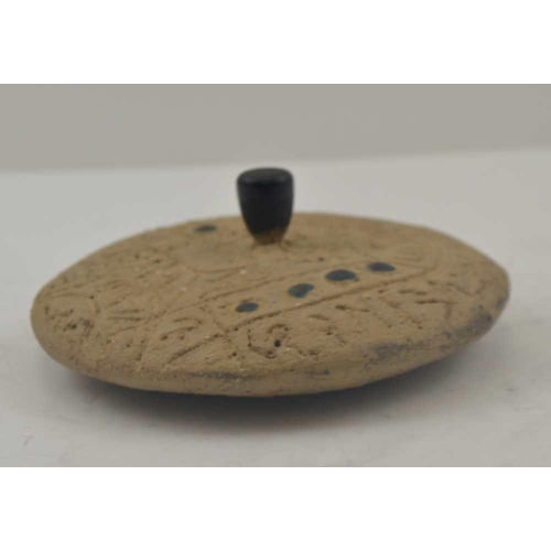 147 - A INCISED STONE DIVINATION DISC, with central bronze handle and bronze studs to both sides, possibly... 