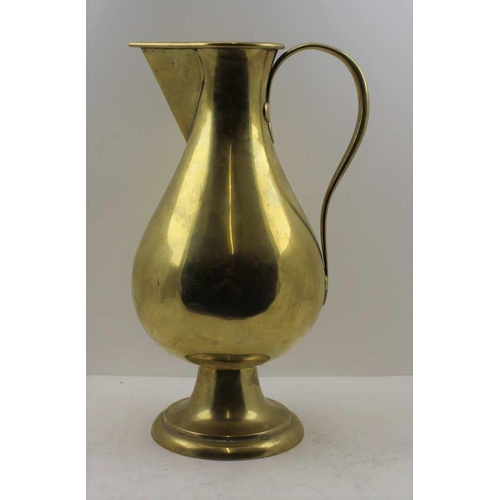 155 - A 'JONES & WILLIS' BRASS EWER JUG in the Gothic Revival taste, scroll handle with trefoil terminals ... 