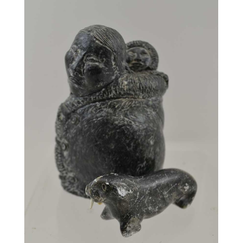 161 - AN INUIT DESIGN FIGURE, mother and child made by Wolf Enterprises 10.5cm high, together with a CARVE... 