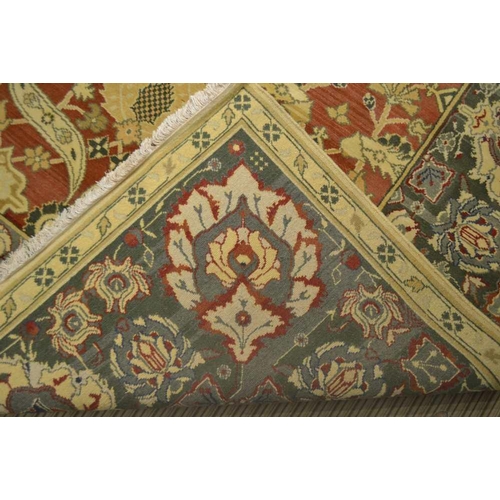 250 - A SPECIALLY COMMISSIONED HAND WOVEN IRANIAN WOOL FLOOR CARPET, in the Donegal palette, of stylised f... 