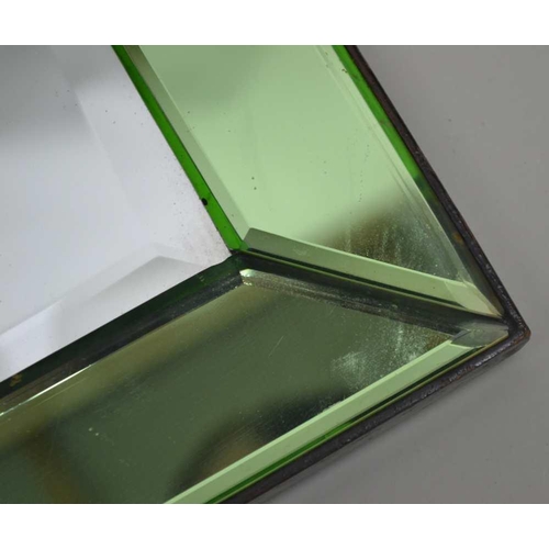 259 - A 20TH CENTURY WALL MIRROR with bevelled green mirror glass frame, overall size, 76cm x 53cm 