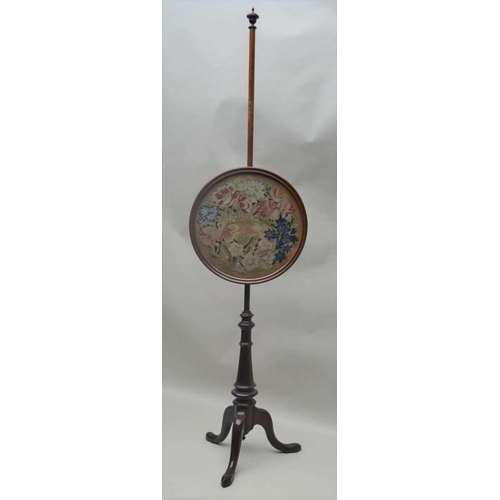 263 - A 19TH CENTURY MAHOGANY POLE SCREEN, raised on triform base, fitted a circular framed panel, with fl... 