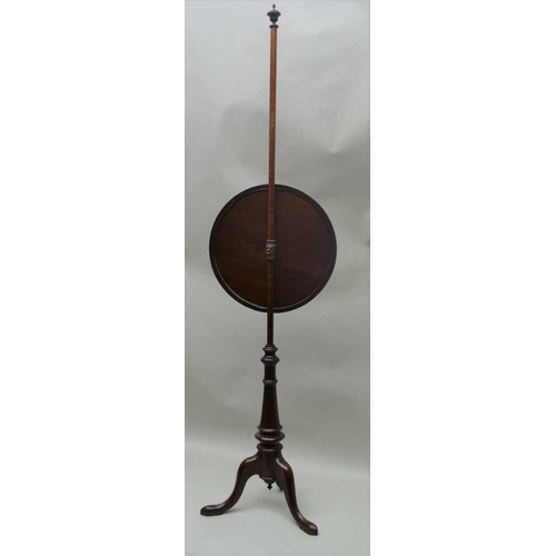 263 - A 19TH CENTURY MAHOGANY POLE SCREEN, raised on triform base, fitted a circular framed panel, with fl... 