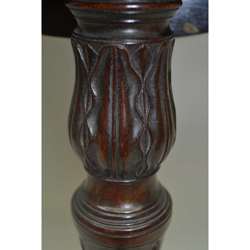 266 - A 19TH CENTURY MAHOGANY SNAP TOP OCCASIONAL TABLE, oval top on carved stem and tripod supports, the ... 