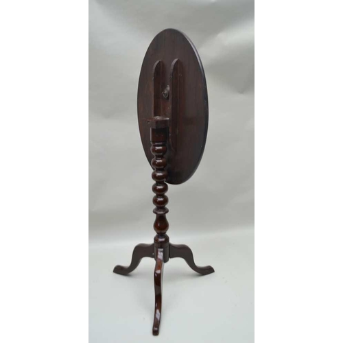 275 - A 19TH CENTURY MAHOGANY SNAP TOP WINE TABLE, on turned stem and tripod supports, oval top 53cm x 38c... 