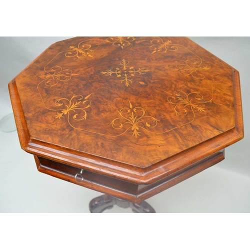 301 - A VICTORIAN INLAID WALNUT OCTAGONAL TOPPED WORK TABLE, having lift-up lid on a tapering faceted colu... 