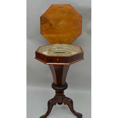 301 - A VICTORIAN INLAID WALNUT OCTAGONAL TOPPED WORK TABLE, having lift-up lid on a tapering faceted colu... 