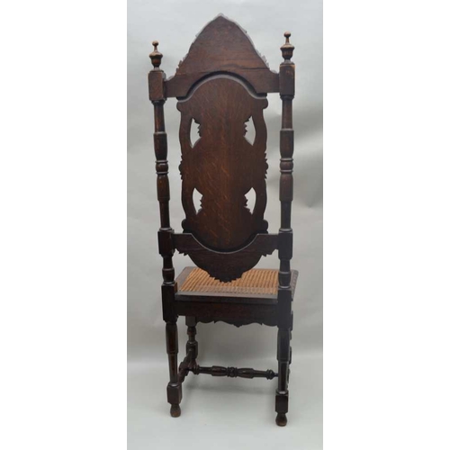 303 - A VICTORIAN OAK JACOBEAN DESIGNED SINGLE CHAIR, having well carved high back, with bergere seat, sup... 