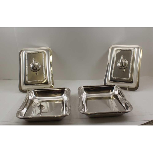 65 - A PAIR OF EARLY 20TH CENTURY SILVER-PLATED ENTREE DISHES of cushion form, by Mappin & Webb, 28cm x 2... 