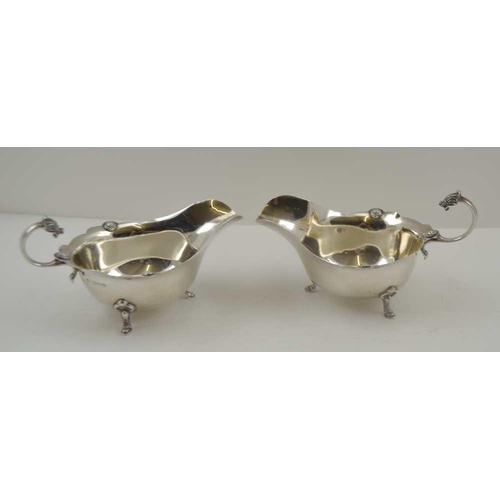 8 - ADIE BROTHERS. LTD A PAIR OF SILVER SAUCE BOATS OF GEORGIAN DESIGN, with cast Celtic form mask handl... 