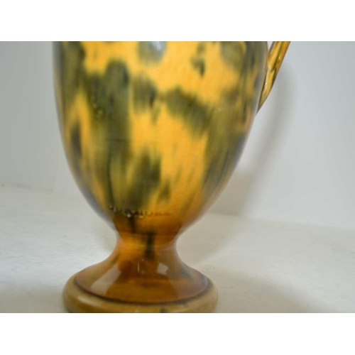 90 - DUNMORE POTTERY A 19th Century Scottish 'Art Pottery' ewer, in egg and spinach glaze, 17cm high, imp... 