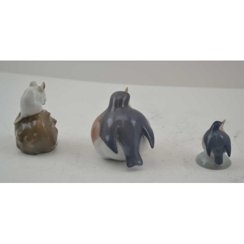 99 - A ROYAL COPENHAGEN CERAMIC MOUSE sat upon a chestnut, 6.5cm high, together with two robins (3) 