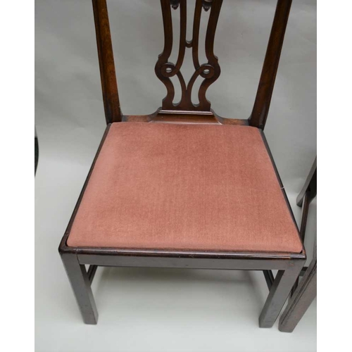 272 - A SET OF FOUR GEORGIAN DESIGN MAHOGANY SINGLE DINING CHAIRS, pierced and carved splats with fabric u... 