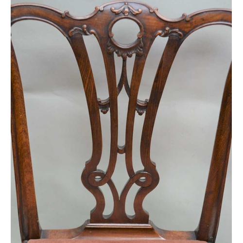 272 - A SET OF FOUR GEORGIAN DESIGN MAHOGANY SINGLE DINING CHAIRS, pierced and carved splats with fabric u... 