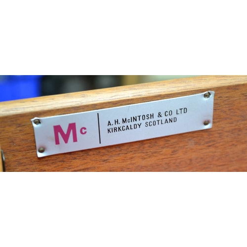 317 - A McINTOSH BRANDED TEAK LONG AND LOW SIDEBOARD, having a combination of cupboard doors, drawers and ... 