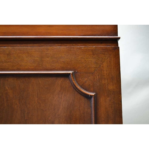 260 - A 19TH CENTURY MAHOGANY LINEN PRESS, fitted two moulded outlined doors under a plain frieze, opening... 