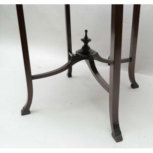 300 - A FIRST QUARTER 20TH CENTURY MAHOGANY FINISHED FANCY TOPPED TABLE, supported on four gently outswept... 