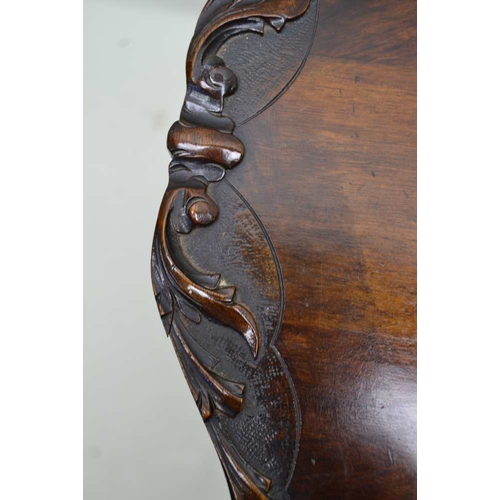 300 - A FIRST QUARTER 20TH CENTURY MAHOGANY FINISHED FANCY TOPPED TABLE, supported on four gently outswept... 