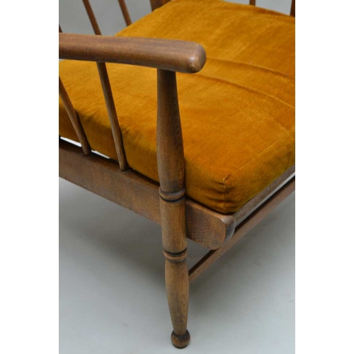 305 - A PAIR OF MID-CENTURY ELM & BEECH STICK BACK WING ARMCHAIRS in the manner of Ercol, having associate... 