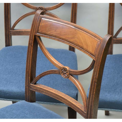 311 - A SET OF SIX LATE REGENCY MAHOGANY SINGLE CHAIRS having 'X' form design backs, overstuffed seat pads... 