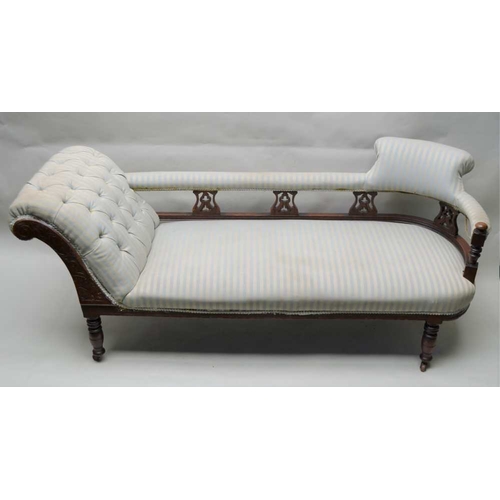 319 - A LATE 19TH / EARLY 20TH CENTURY SHOW WOOD FRAMED CHAISE LONGUE with buttoned reclining side, uphols... 