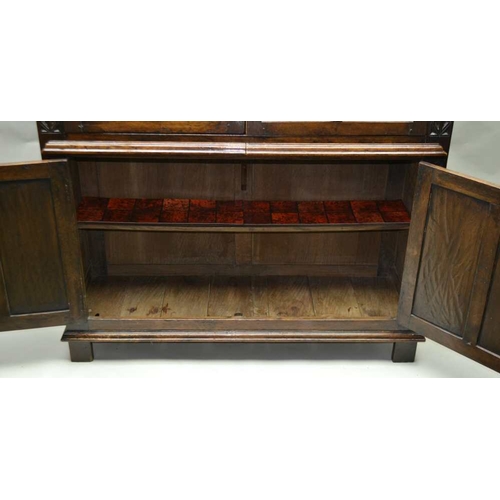 261 - A 20TH CENTURY OAK COCKTAIL CABINET, in the 17th century style, with linen fold and blind fret decor... 