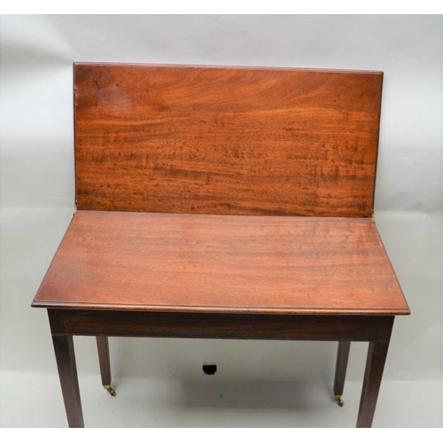 285 - A 19TH CENTURY MAHOGANY FOLDOVER TEA TABLE, rectangular top on squared tapering supports with castor... 