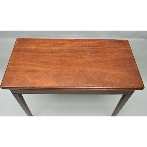 285 - A 19TH CENTURY MAHOGANY FOLDOVER TEA TABLE, rectangular top on squared tapering supports with castor... 