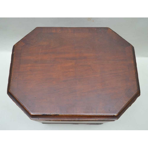 294 - AN EARLY 19TH CENTURY MAHOGANY CELLARET of tapering canted form, having hinged cover, fitted brass r... 