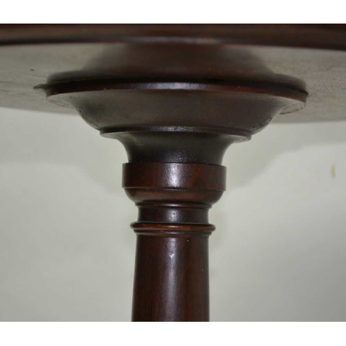 313 - A FIRST QUARTER 20TH CENTURY MAHOGANY JARDINIERE STAND, having saucer top, on turned baluster column... 