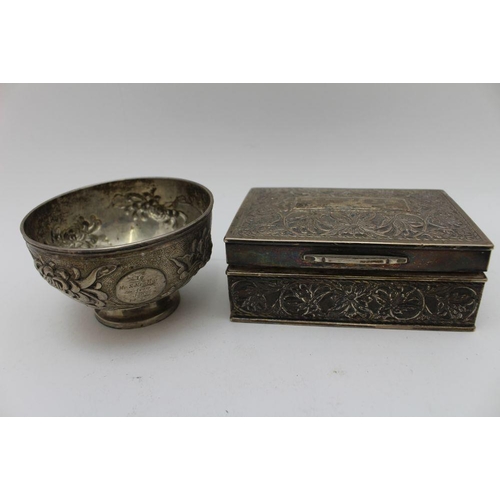 12 - An early 20th century Chinese white metal bowl, with repousse chrysanthemum decoration, raised on ci... 