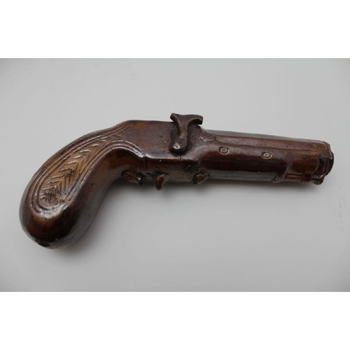 128 - A 19th century salt glazed earthenware novelty spirit flask modelled as a percussion pistol, maybe F... 