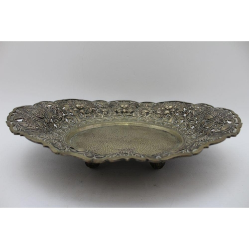 14 - A pair of early 20th century white metal Far Eastern plates, pointed edge, repousse and chased decor... 