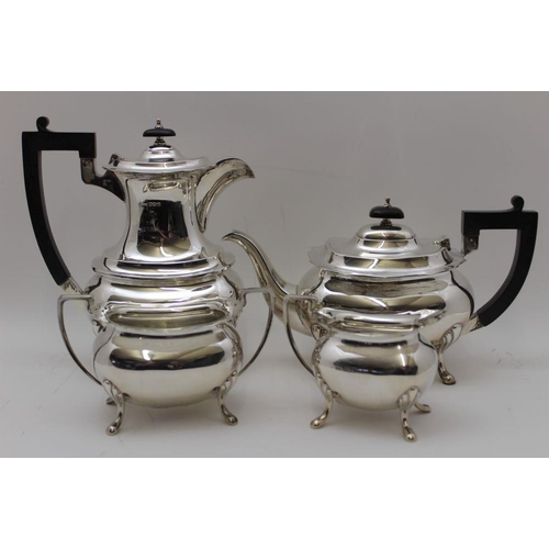 2 - A Walker & Hall four piece silver tea set, comprising; teapot, hot water pot, milk jug, and a two-ha... 