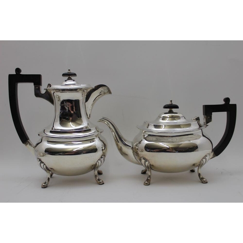 2 - A Walker & Hall four piece silver tea set, comprising; teapot, hot water pot, milk jug, and a two-ha... 